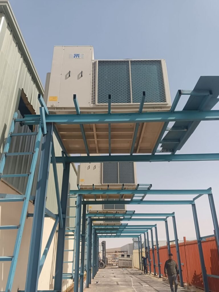 Expert technician repairing split and central AC units in Al Badi'ah Riyadh