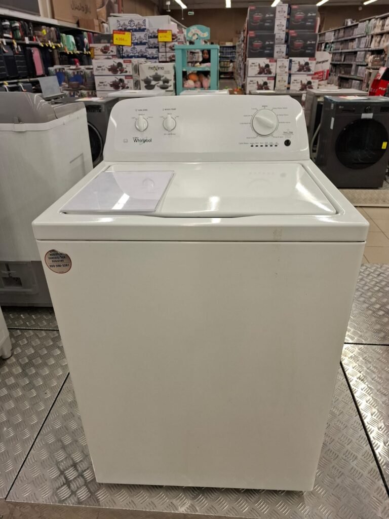 Certified appliance technician repairing a Whirlpool top-load automatic washing machine in Al Badi'ah Riyadh